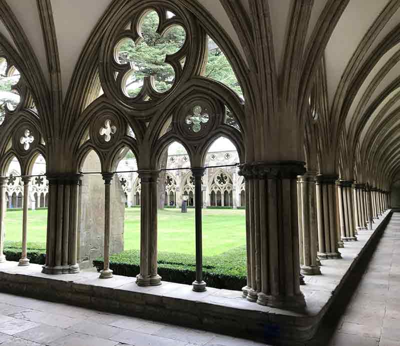 Covered walkway with ornate Gothic style arches.